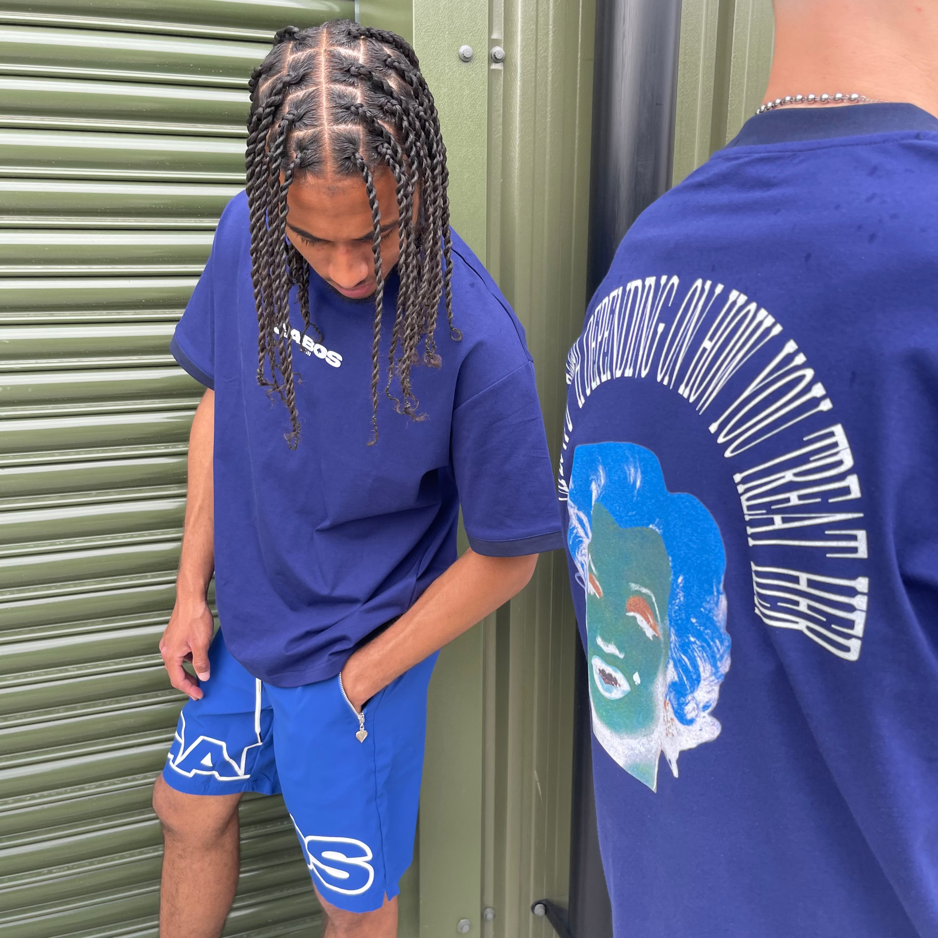 Blue gabos OG short worn with a navy gabos top