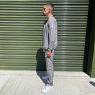 Menswear look: Gabos London 3-piece grey tracksuit set styled with white Air Force 1s, combining comfort and street credibility