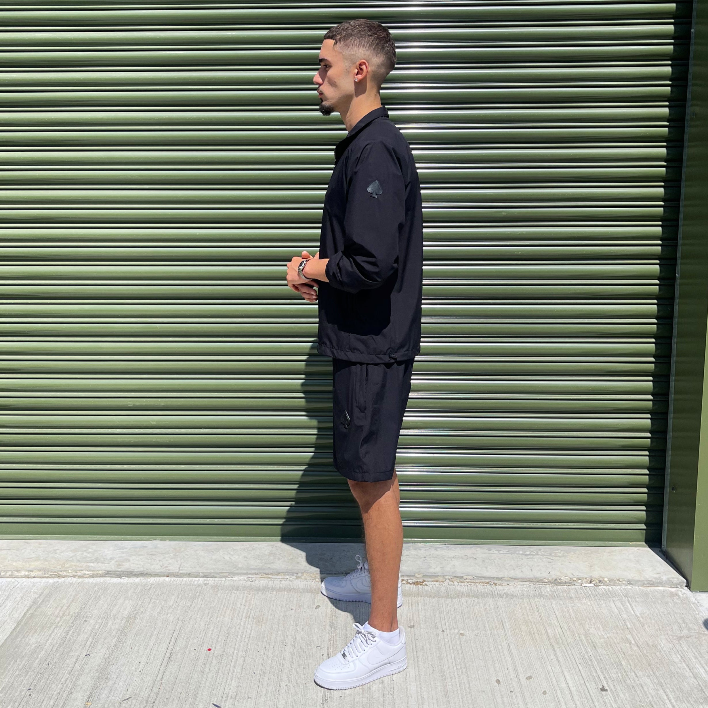 Men’s black tracksuit and shorts combo from Gabos London, perfect for transitional streetwear with modern athletic appeal
