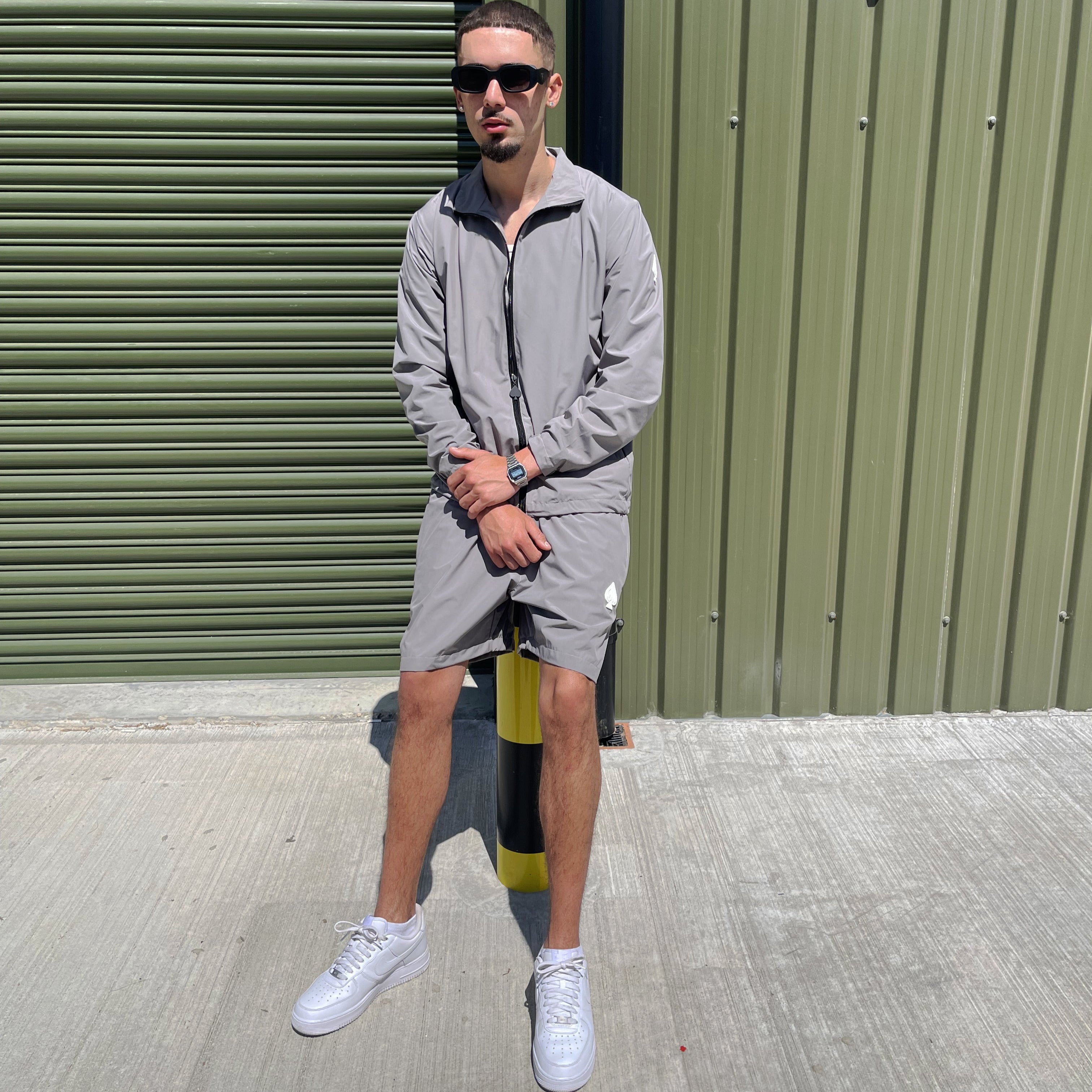 Contemporary grey matching tracksuit set with lightweight shorts – a Gabos London essential for elevated everyday urban wear.