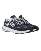 A pair of  GABOS athletic sneakers in navy blue, white, and black, featuring a mesh and suede upper, white laces, and a chunky white and black sole.