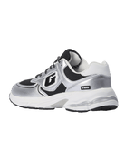A silver and black athletic sneaker with a chunky white sole, featuring a metallic silver upper, black mesh panels, and a white midsole.
