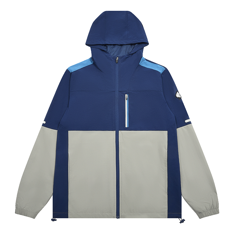 A color-blocked tracksuit hooded jacket with a navy blue upper body and sleeves, light blue shoulder panels, and a large light gray lower body panel, shown on a plain white background.