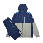 A two-piece athletic tracksuit set consisting of a hooded zip-up jacket and matching pants, shown on a clean white background. The jacket features a color-blocked design with navy blue, light blue, and light gray panels, while the matching pants are solid navy blue.