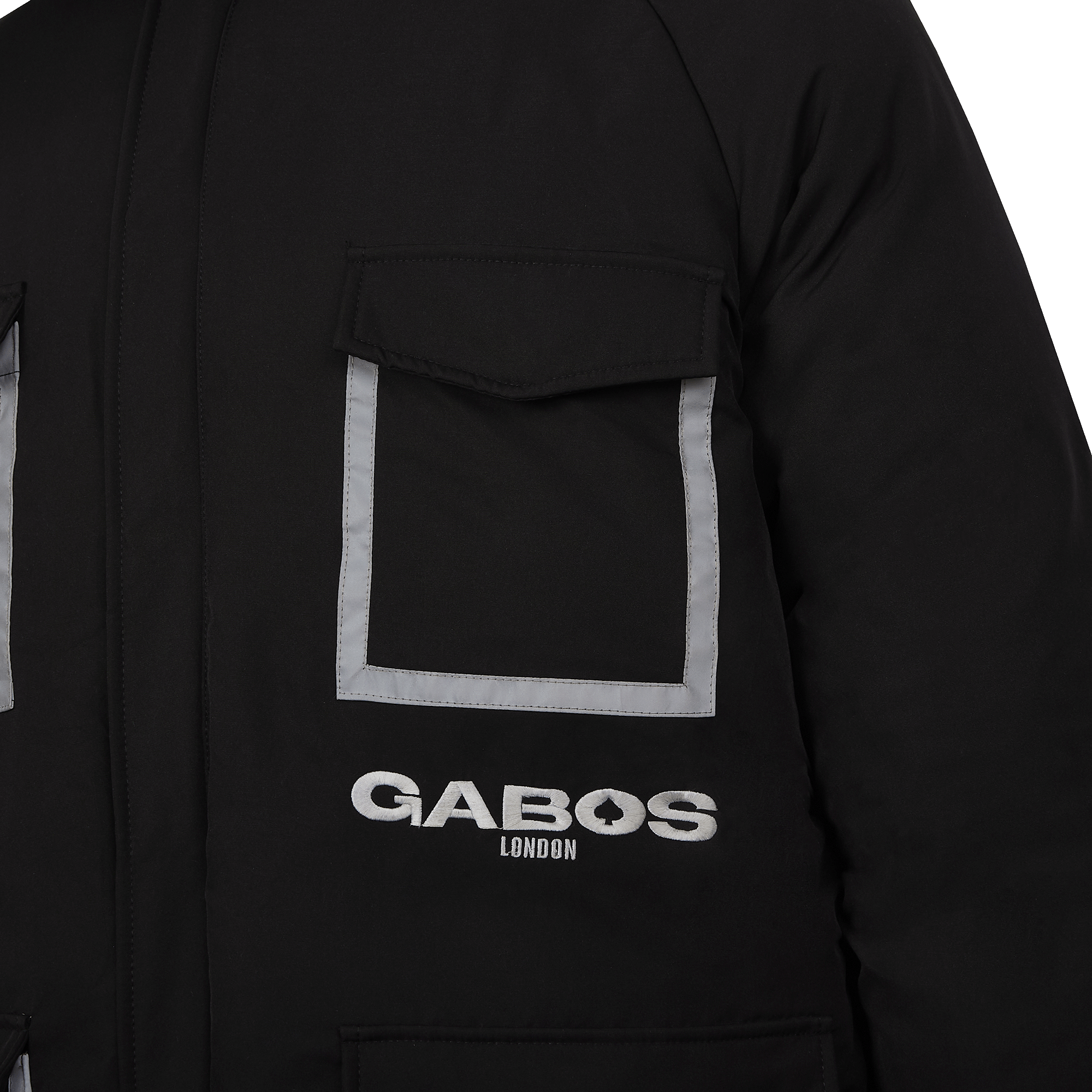 Close-up of a black puffer jacket featuring a front flap pocket with reflective silver trim and the 'GABOS LONDON' logo printed in white below.