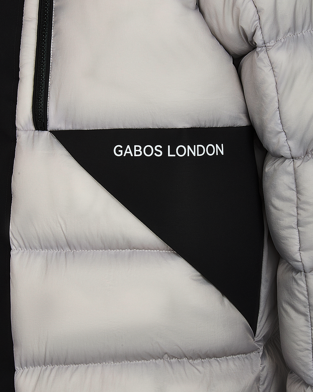 puffer jacket pocket. Gabos london reflective text print