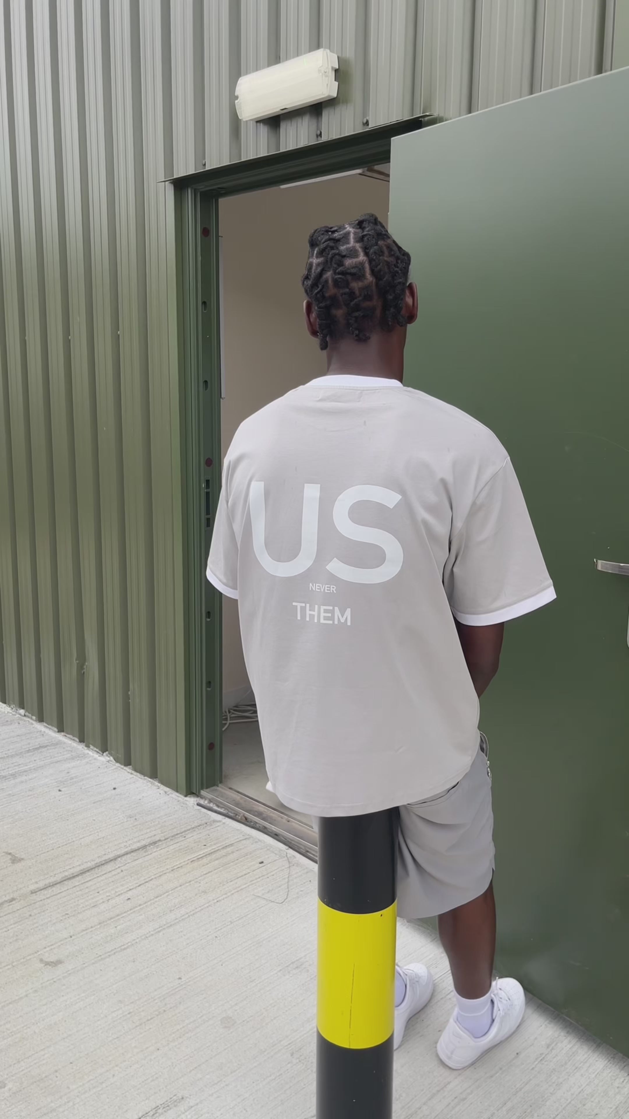 modelling the grey og gabos shorts with grey us never them t shirt for gabos summer streetwear collection