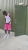 seen here modelling pink gabos og shorts in colour pink while pairing it with white air forces and white vest. This is streetwear