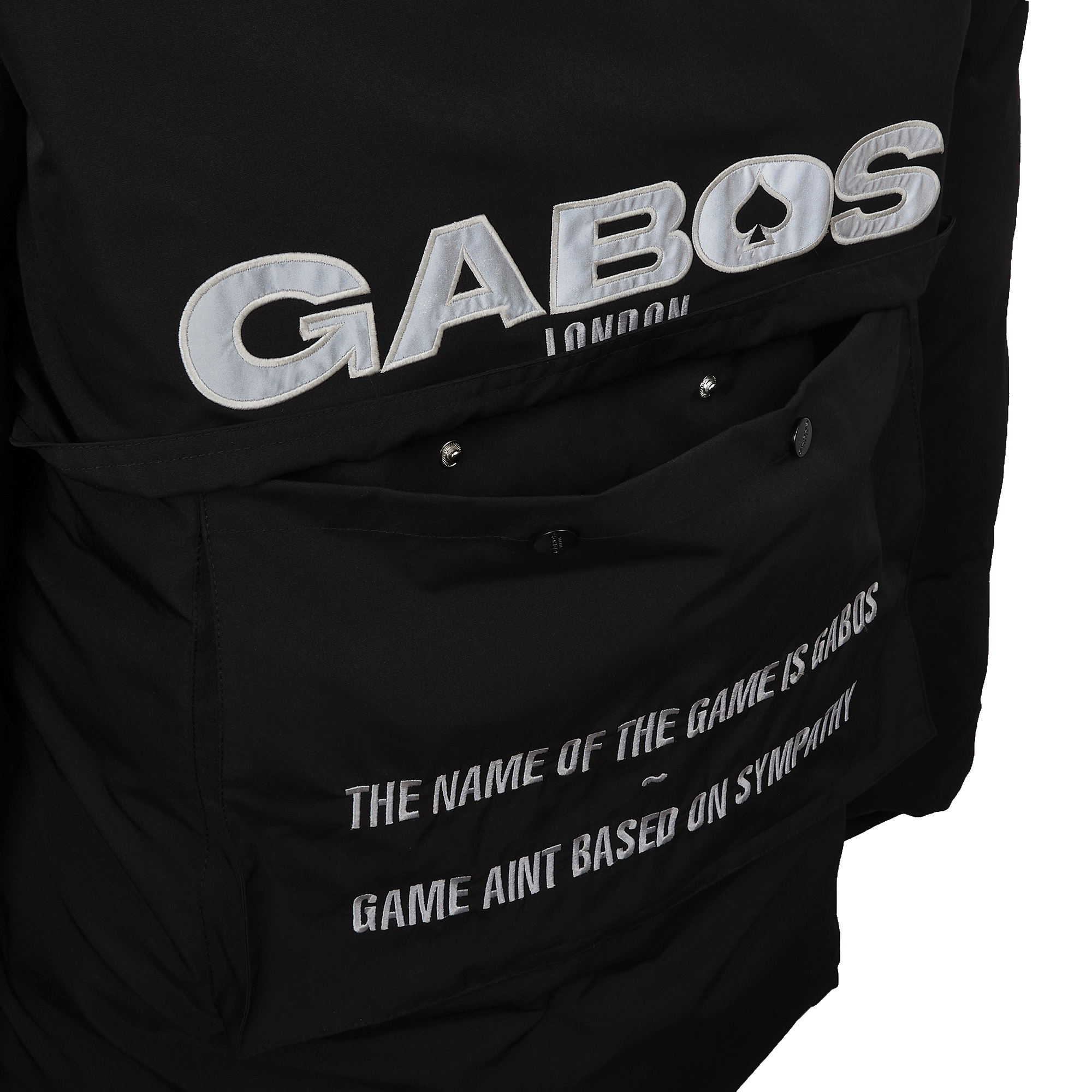 Close-up of a black jacket featuring a large metallic silver 'GABOS LONDON' logo on the back and white printed text on a back pocket.