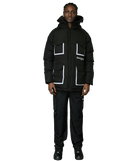 A model wearing a black puffer jacket with white contrast stitching and pocket details, paired with black cargo pants and black shoes, set against a plain white background.